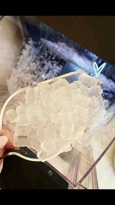 a person is holding an object with ice on it