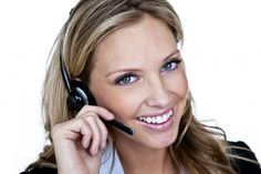 a woman talking on a cell phone while wearing a headset