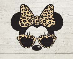 a minnie mouse with leopard print on it's head and sunglasses in the shape of a heart