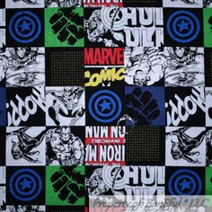 an image of the avengers comics on black and white fabric with blue, green, yellow and