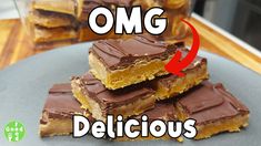 chocolate and peanut butter bars stacked on top of each other with the words omg delicious