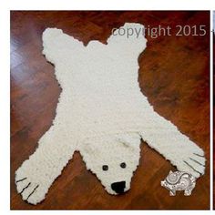 a polar bear rug is laying on the floor