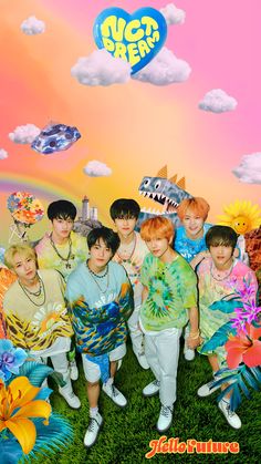 the group is posing for a photo in front of a colorful background with clouds and monsters