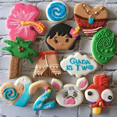 decorated cookies are arranged on a brick wall