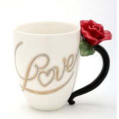 a white coffee mug with a red rose in the middle and love written on it