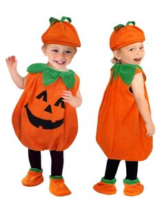 two young children dressed in pumpkin costumes