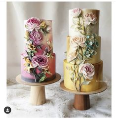 there are three cakes that have flowers on the top and bottom one is multicolored