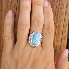 Women's Native American Navajo Turquoise Sterling Silver Ring With A Traditional, Detailed, Handcrafted Border, Highlights The Beautiful Blue Turquoise Stone With Its Caramel Colored Matrix. This Ring Will Flatter Every Woman's Hand With Southwest Style. It Is Timeless And Always In Style! Size: 8 1/4 Signed: Jn,(On The Band) Jeffery Nelson, Navajo Native American Artist Sterling Silver 7/8" By 5/8" Weighs: 8 Grams Brand New Made In The Usa Free Shipping In The United States Unique Untreated Turquoise Ring, Untreated Turquoise Ring, Unique Turquoise Gemstone Ring, Untreated Oval Turquoise Ring, Turquoise Cabochon Ring For Anniversary, Untreated Sterling Silver Turquoise Ring, Turquoise Anniversary Ring, Oval Turquoise Ring For Anniversary, Oval Turquoise Anniversary Ring