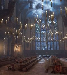 the inside of a large building with chandeliers hanging from it's ceiling