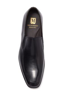 Buttery leather composes this slip-on pair of loafer dress shoes. Sizing: true to size. Moc toe. Slip-on style. Leather construction. Made in Italy Classic Closed Toe Slip-ons With Rubber Sole, Business Leather Slip-on Shoes With Rubber Sole, Office Slip-ons With Rubber Sole, Formal Tassel Loafers With Stitched Sole, Slip-on Oxfords With Stitched Sole And Plain Toe, Formal Slip-on Tassel Loafers With Stitched Sole, Formal Tassel Slip-on Loafers With Stitched Sole, Classic Slip-on Closed Toe Dress Shoes, Classic Slip-on Oxfords With Stitched Sole