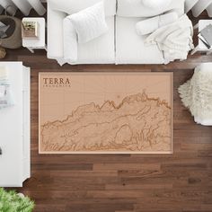 a living room with a couch, coffee table and map on the wall above it