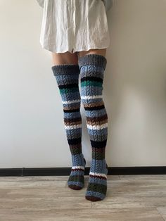 Thigh high socks Slouch socks Wool socks Knee high socks Hand knit socks READY TO SHIP Variation 1: Eu size 37 - 39 length - 70 cm (27.5 inches) Content: wool, merino wool, polyamide, acrylic Variation 2: Eu size 37 - 39 length - 70 cm (27.5 inches) Yarn: pure wool, lambs wool, alpaca wool - from Norway Variation 3: Eu size 37 - 39 length - 71 cm (28 inches) The socks are made in 100% wool. Can be a gift for a loved one, for friends, or loved ones! Sized to fit an adult woman or teenager. Model 170 cm heigh and leg volume in the thickest place 48 cm (18.9 inches) To avoid slipping, use elastic bands or suspenders (not included) Care hand knit socks: Hand Wash, max 30oC Don't bleach Don't iron Can be dry cleaned Don't tumble dry Dry Flat Please note that a slight color difference should be One Size Knitted Knee-high Socks, Warm One Size Knee-high Socks, Hand Knitted Knee-high Socks For Winter, Hand Knitted Knee-high Winter Socks, Handmade Fitted Cozy Socks, Knee Length Socks Outfit, Knit Thigh High Socks, Socks Knee High, Slouch Socks