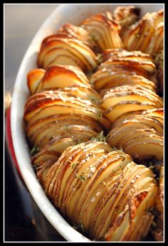 baked potatoes with herbs in a white dish