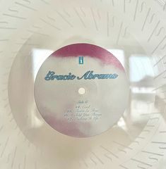 a white disc with blue writing on it and the words bracquet avenue printed on it