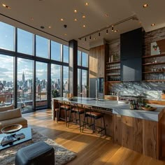 an open kitchen and living room with floor to ceiling windows overlooking the cityscape