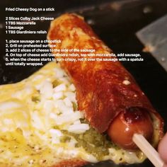 a hot dog on a stick with toppings