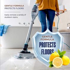 a woman is using a vacuum to clean the floor in front of a sign that says gentle formula protects floors