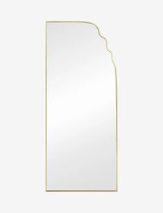 a white and gold mirror with an arch shaped design on the front, against a gray background