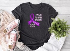 I Wear Purple For My Dad T-Shirt, Purple Ribbon Tee, Alzheimer's Purple Shirt, Alzheimer's Awareness Shirt, I Wear Purple For My Dad Shirt ⭐⭐TapanCustomTees⭐⭐ ⭐ All orders totaling $35 and up ship for free to US buyers. ⭐ We use white vinyl for all colors but black vinyl for white, peach, heather athletic grey shirts. If you want black or gold vinyl please indicate on the personalization part. ⭐ Sweatshirts and Hoodies: 8-ounce, 50/50 cotton/poly. T-Shirts:4.3-ounce, 100% combed ring spun cotton.  ⭐ Return policy: since it is print on demand type business we are unable to accept a return, unless there is a defo on the product. ⭐ Shipping: Ground Advantage shipping 2-5 business day. For express shipping you should upgrade the shipping option. Purple T-shirt For Awareness Events With Letter Print, Purple T-shirt With Letter Print For Awareness Events, Purple Casual Top For Awareness Events, Casual Purple Top For Awareness Events, Alzheimer's Awareness, Alzheimers Awareness, Gold Vinyl, Purple Ribbon, Sweatshirts And Hoodies