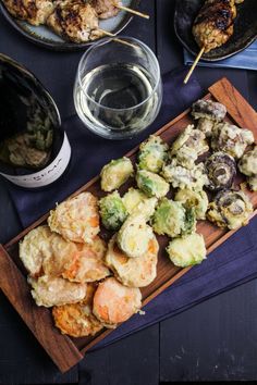 an assortment of food and wine on a table