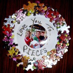 there is a plate that has some puzzles on it with the words love you to pieces