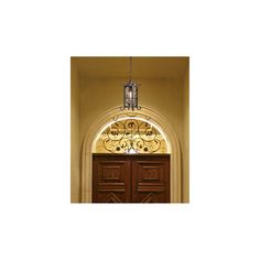 an arched doorway with a chandelier hanging from the ceiling