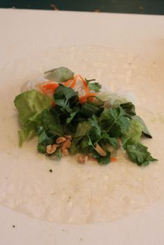 a white plate topped with lettuce and carrots