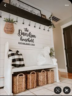 a white bench with baskets on it in front of a sign that says the davidson house