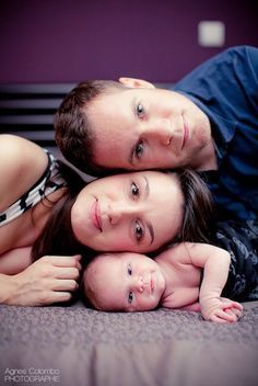 a man and woman laying on top of each other