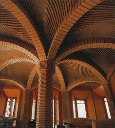 the interior of a building with arches and windows