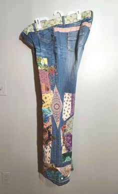 A whole lot of patches over patches on these jeans! Quilt blocks, birds, flowers, stars, moon, turtle and palm tree. The waistband is even patched! The back pockets came with a small goldtone stud design. Hydraulic brand, 97% cotton and 3% spandex. Size 20. Measurements: rise 11" waist 42" hips 48" upper thigh 25" inseam 34" To make sure these will fit you, please start with the rise, measuring from the crotch up 11" where that lands and if you measure around that 48" then these jeans should fit Jeans Quilt, Bell Bottom Jeans 70s, Denim Patchwork Jeans, 70s Clothes, Hippie Grunge, Reverse Applique, Plus Size Denim, Stars Moon, Bottom Jeans