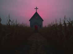 a small church in the middle of a cornfield at sunset with a cross on top