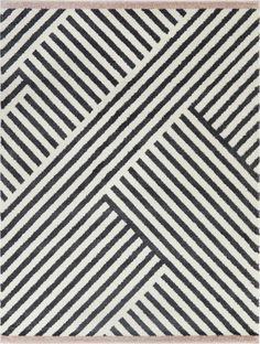 a black and white rug with diagonal stripes