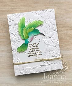 a close up of a card with a bird on it