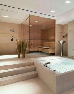 a bathroom with a large jacuzzi tub next to stairs