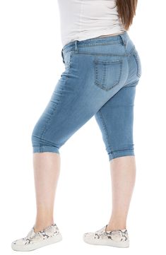 Cut to flatter curves and move with ease, these stretchy capris are right on trend with a faded wash and released raw hems. 18" inseam; 14 1/2" leg opening; 10" front rise; 18" back rise (size Medium) 52% cotton, 29% rayon, 17% polyester, 2% spandex Machine wash, tumble dry Imported Stretch Denim Knee-length Jeans, Stretch Knee-length Cropped Denim Jeans, Stretch Medium Wash Cropped Leg Capris, Stretch Medium Wash Cropped Capri Jeans, Medium Wash Stretch Knee-length Bottoms, Stretch Medium Wash Cropped Capris, Stretch Medium Wash Capris With Cropped Leg, Medium Wash Knee-length Denim Capris, Knee-length Cropped Denim Jeans