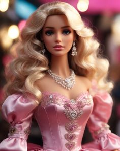 a barbie doll wearing a pink dress and tiara with pearls on it's head