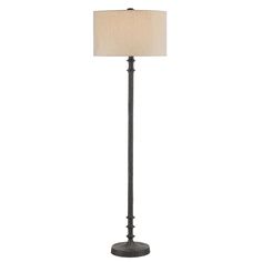 a floor lamp with a white shade on the base and a black iron finish frame