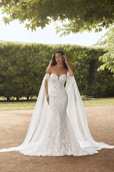 a woman wearing a wedding dress and veil