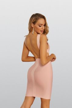 Sultry and sexy, Eliana's backless dress features a bandage-style, body-hugging silhouette to show off your curves and leave them wanting more. With a plunging neckline and backless design, you'll have the attention of anyone in the room. Complete your look with a pair of pumps or strappy sandals  Dress Length: Approx 83cm Materials: Bandage (90% Viscose, 9% Nylon, 1% Elastane) Stretch Type: Very Stretchy Gentle Dry Clean Only   Model is 5 ft 8 and wears size S   Colour may vary due to lighting Silver Sequin Top, Glitter Wedding Dress, Wanting More, Bandage Midi Dress, Floral Shirt Dress, Backless Design, Puff Sleeve Dresses, In The Room, Maxi Knit Dress