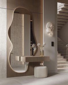 a bathroom with a sink, mirror and vase on the counter in front of stairs