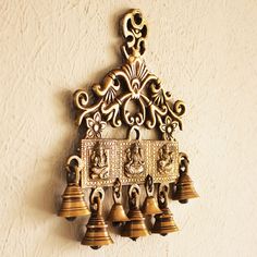 the bells are hanging on the wall