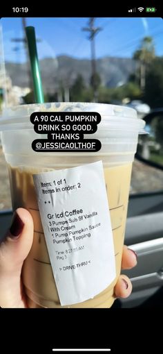 a person holding up a cup with a drink in it's hand and the words, a 90 cal pumpkin drink so good thanks thank you