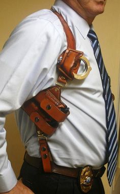 an older man wearing a tie and suspenders