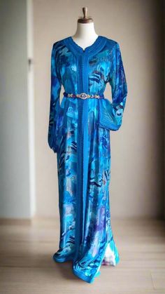 This is a truly Royal vintage blue Moroccan wedding kaftan dress made in Morocco, made of beautiful Blue Floral Lace and blue silk embroidered with blue large thread This Takchita includes: ✓ Main Kaftan: made from the finest traditional soft silk with Blue Moroccan thread and long sleeves Condition: Great 😃👍 ✓under Kaftan: made from blue satin silk with Blue large thread and long sleeves ✓Condition: with some scratches on the front of the dress and some of them on the sleeves Care: Washed and Lace Caftan, Moroccan Kaftan, Moroccan Wedding, Moroccan Caftan, Wedding Dresses For Sale, Kaftan Dress, Blue Satin, Embroidered Silk, Blue Lace