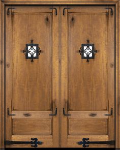 two wooden doors with wrought iron handles on each side and the top panel is made of wood