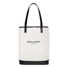 This "Teddy" bucket bag is is crafted of an off-white coated linen with a black printed Saint Laurent logo. The open top bucket bag includes a detachable black leather drawstring insert with a suede pouch. This is a perfect tote for on the go and everyday use, with the distinctive style from Saint Laurent!          Model number: 551595  Coated linen  Smooth black leather details  Printed Saint Laurent Paris logo  Removeable black leather drawstring insert with suede interior and suede pouch  Dou Designer Coated Canvas Bucket Bag For Daily Use, Designer Coated Canvas Bucket Bag For Shopping, Designer Bucket Bag For Errands, Designer Coated Canvas Bucket Bag, Casual Bucket Bag With Canvas Lining For Shopping, Luxury Bucket Bag For Errands, Casual Bucket Bag For Shopping, Designer Bucket Bag With Leather Trim, White Canvas Bucket Bag For Errands