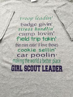 a t - shirt with the words girl scout written on it in green and purple