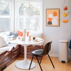 a white table and chairs in a room