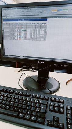 a computer monitor sitting on top of a desk